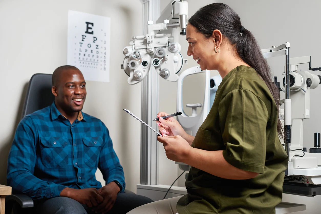 Image of an optometrist conducting an eye examination on a patient
