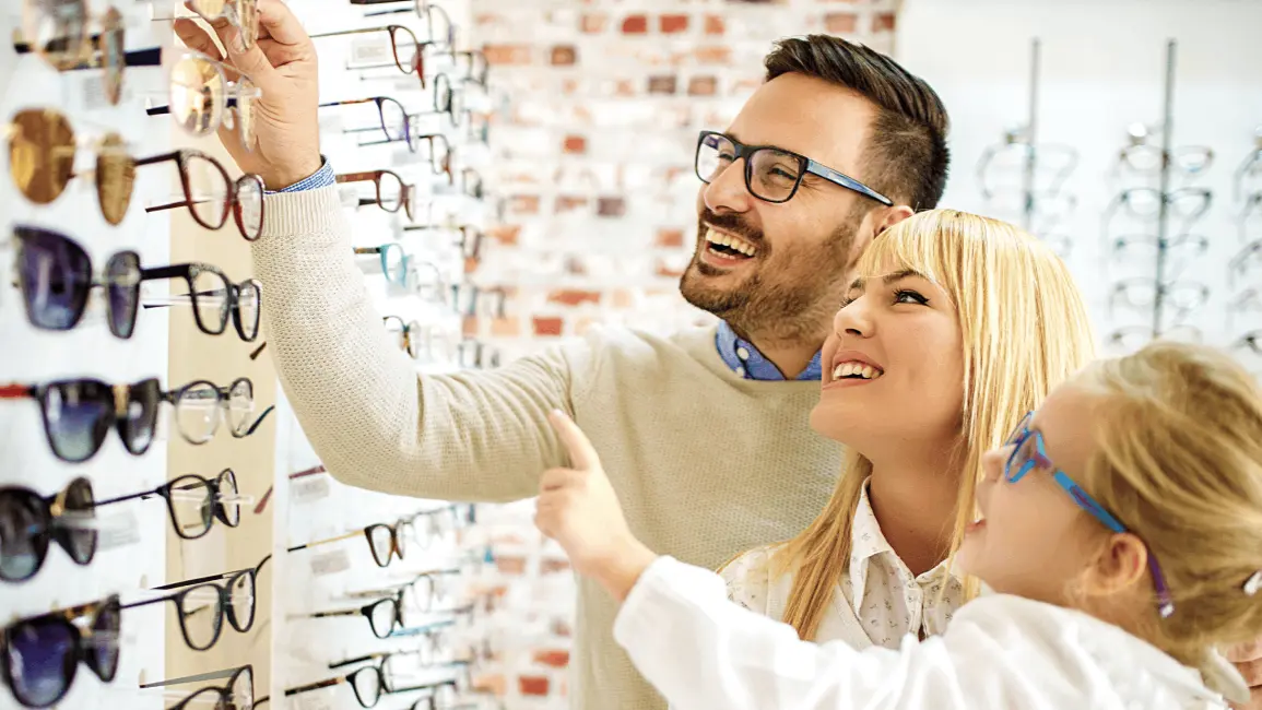 image of patients looking through a glass gallery to select a suitable frame
