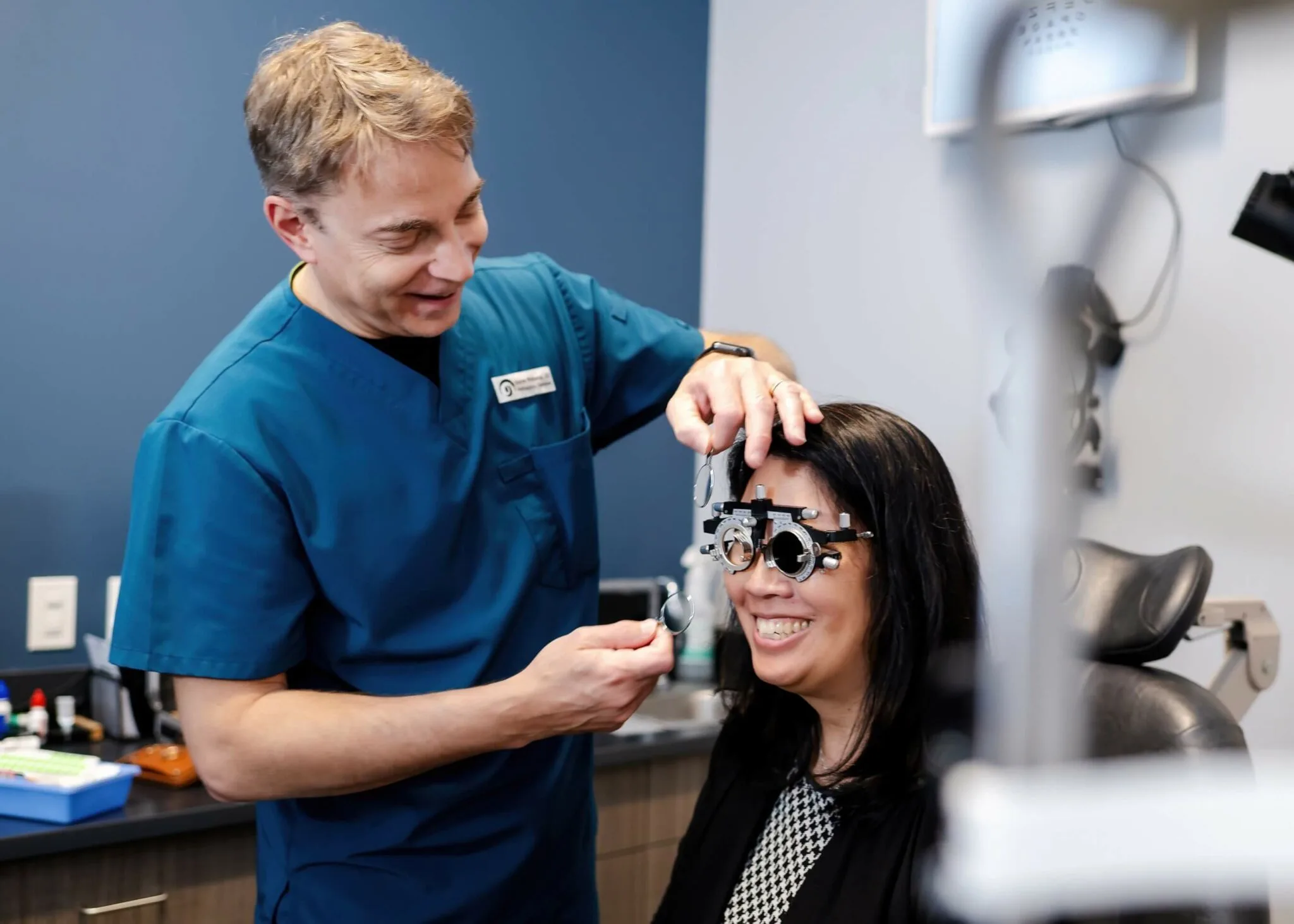 Optometrist performing a comprehensive eye examination for a patient